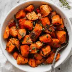 Easy Roasted Sweet Potatoes and Carrots with Maple, Cinnamon, and Herbs Recipe