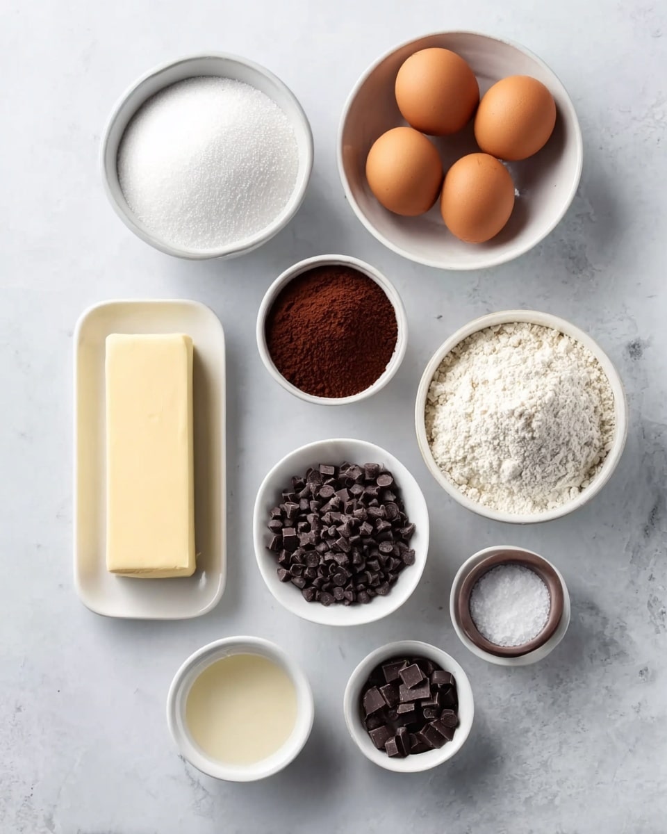 The image shows nine white bowls and a rectangular white plate arranged neatly on a white marbled surface. Starting from the top left, there is a bowl filled with white sugar, next to it a bowl with four brown eggs. Below the sugar is a rectangular white plate with a block of light yellow butter. In the center is a bowl filled with dark brown cocoa powder. To the right of the cocoa powder, a bowl holds white flour. Below the eggs, there is a small white bowl containing white salt, and next to it is a small bowl with a light beige liquid, likely vanilla extract. The bottom row has three bowls: the left one filled with dark chocolate chips, the middle one contains brown sugar, and the right one holds smaller dark chocolate pieces. The setting is bright and clean, with an overhead view. Photo taken with an iphone --ar 4:5 --v 7