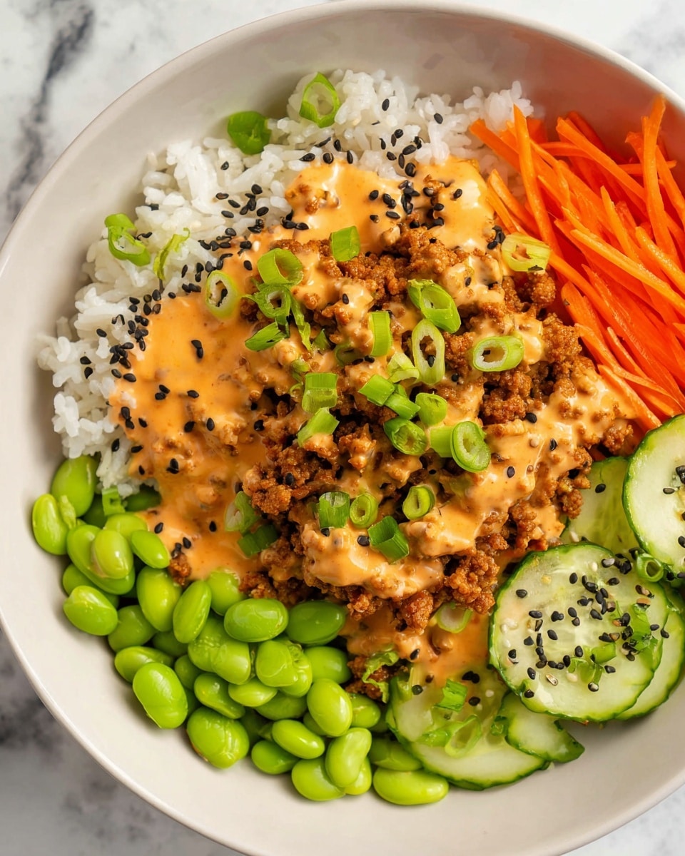 A white bowl holds a colorful dish with four main layers arranged side by side: on the left, white rice topped with black sesame seeds; next to it, bright green edamame beans; then thin orange carrot strips; and on the right, sliced light green cucumber pieces sprinkled with black sesame seeds. The central top layer consists of golden brown cooked ground meat covered with creamy orange sauce and garnished with sliced green onions. The background is a white marbled texture. Photo taken with an iphone --ar 4:5 --v 7