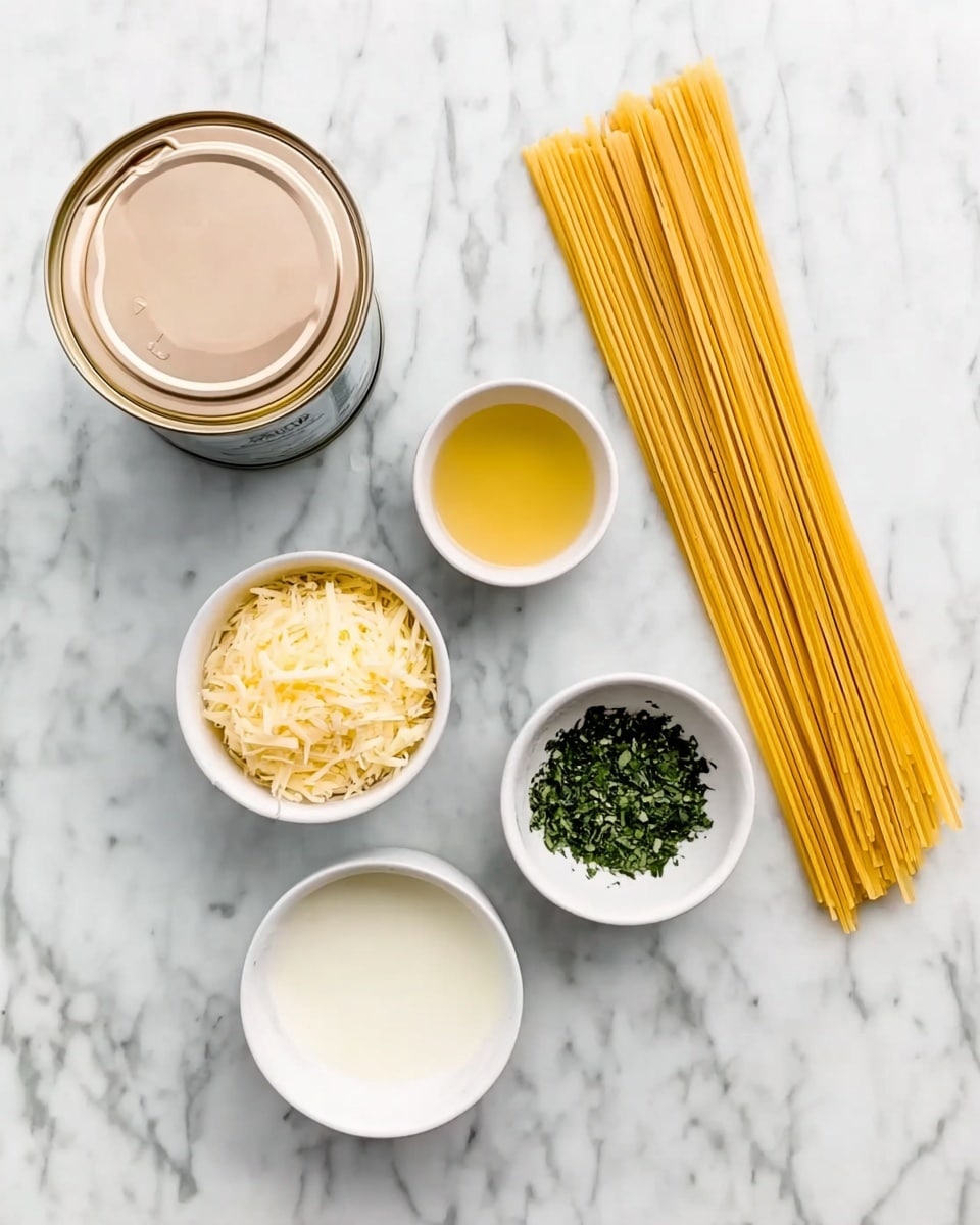 The image shows several ingredients neatly arranged on a white marbled surface. On the top left, there is an open can with light beige contents inside, next to long uncooked yellow pasta strands on the right. Below the can, there is a small white bowl with grated light yellow cheese, and right next to it, a small white bowl filled with chopped dark green herbs. Between these bowls is a small white bowl filled with a white liquid, and above it, a small round yellow cup holding a light golden liquid. The setup is simple, with each ingredient clearly visible and separated. photo taken with an iphone --ar 4:5 --v 7