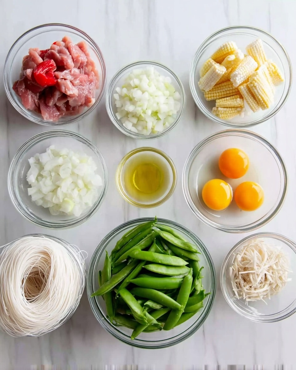 The image shows eight clear glass bowls arranged on a white marbled surface, each holding different cooking ingredients. Starting from the top left, the first bowl contains raw pink meat pieces. Next to it, small white chopped onion pieces fill the bowl. To the right, baby corn is placed in the bowl. Below that, three raw eggs with yellow yolks sit in another bowl. Moving down, a small bowl holds a light yellow cooking oil. Near it, a bowl contains finely chopped garlic. In the center, a bowl full of fresh green snap peas is visible. Finally, at the bottom left, a bowl holds uncooked white rice noodles. All bowls and the background have a clean and bright appearance. Photo taken with an iphone --ar 4:5 --v 7